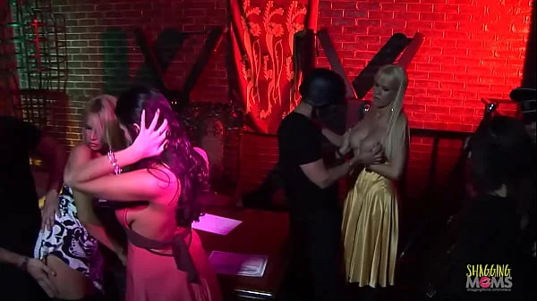 Captive blonde and brunette milf agents use their big tits to have group sex with the criminals