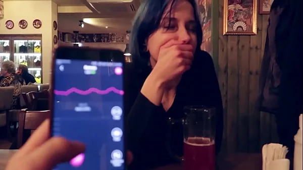 I took control of my stepsister's vibrator in the bar and brought her to orgasm.