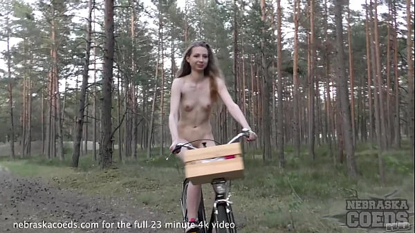 skinny areana fox riding a bicycle nude outdoors in a forest and masturbating