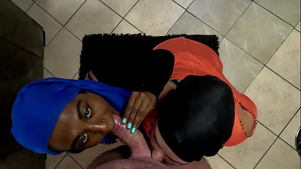Two Muslim hijab woman on their knees sucking dick and getting their faces covered with cum