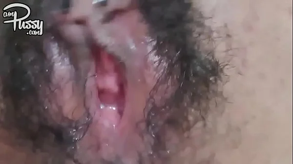 Extreme close-up hairy pussy masturbation