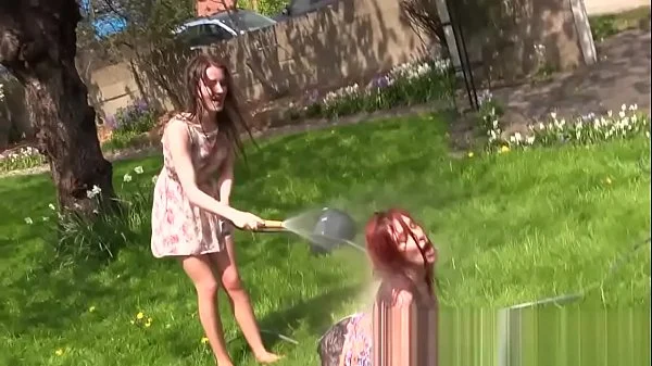 Two Girls get wet in Garden and Strip