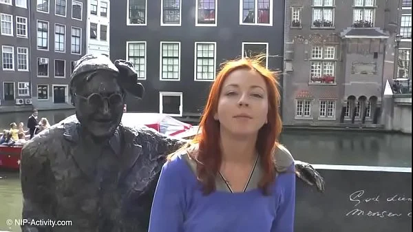 Pretty redhead walking naked in Amsterdam