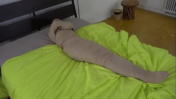 Blue haired Teen girl put in mummification